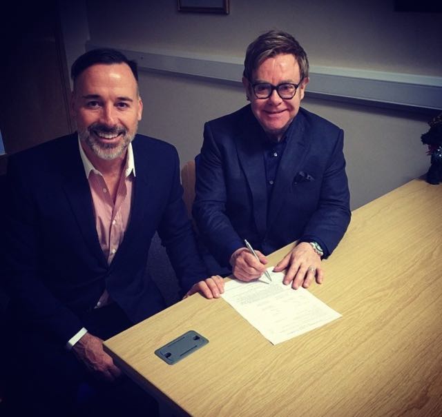 Elton David sign papers